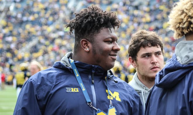 The nation's top center, Cesar Ruiz, has committed to Michigan.