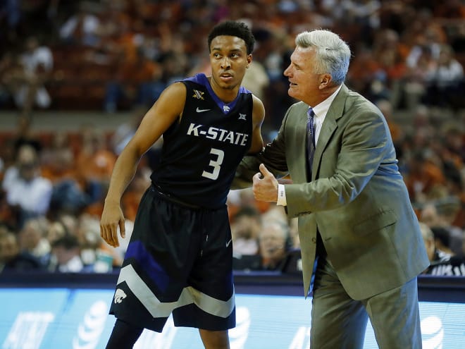 Bruce Weber offers point guard Kamau Stokes advice during Saturday's win at Texas.