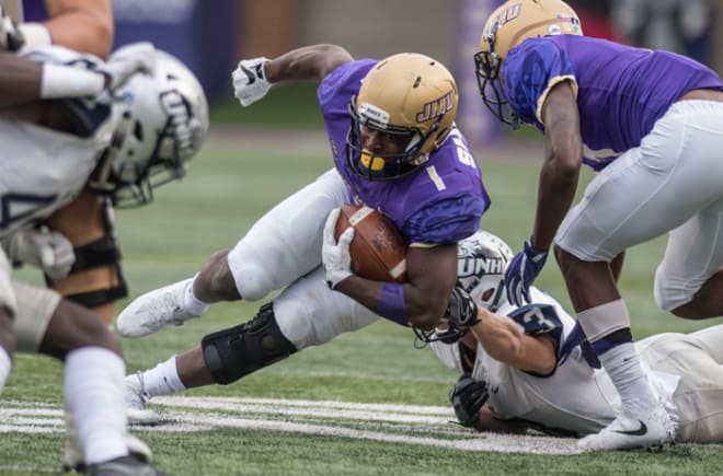James Madison junior running back Trai Sharp carries the ball during the Dukes' win over New Hampshire last month in Harrisonburg.