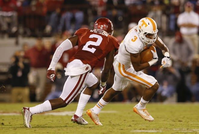 Sep 13, 2014; Norman, OK, USA; Tennessee Volunteers wide receiver Josh Malone (3) runs with the ball as Oklahoma Sooners cornerback Julian Wilson (2) chases during the first half at Gaylord Family - Oklahoma Memorial Stadium.