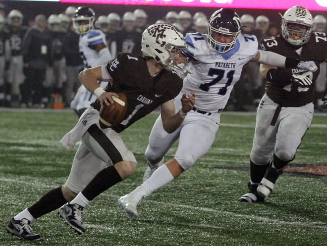 Justin Lynch led Mount Carmel to a perfect 14-0 record and the school's 13th state football title.