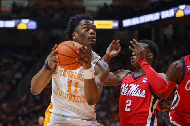 Jan 6, 2024; Knoxville, Tennessee, USA; Tennessee Volunteers forward Tobe Awaka (11) goes to the basket against Mississippi Rebels guard TJ Caldwell (2) during the first half at Thompson-Boling Arena at Food City Center. 