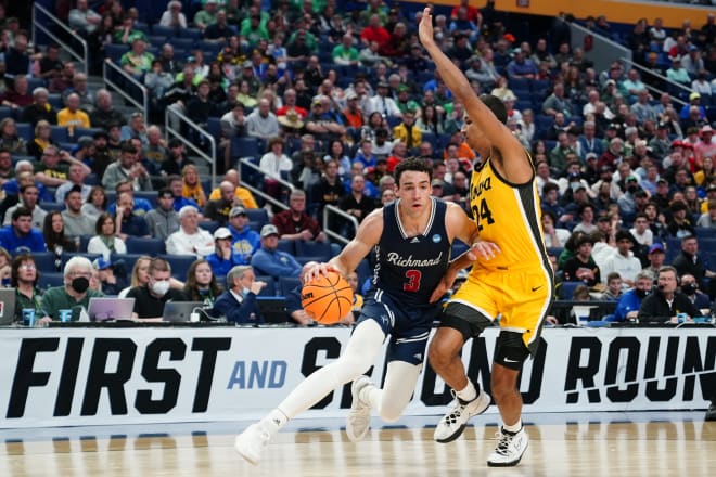 Mar 17, 2022; Buffalo, NY, USA; Richmond Spiders forward Tyler Burton (3) drives to the basket against Iowa Hawkeyes forward Kris Murray (24) in the first half during the first round of the 2022 NCAA Tournament at KeyBank Center. 