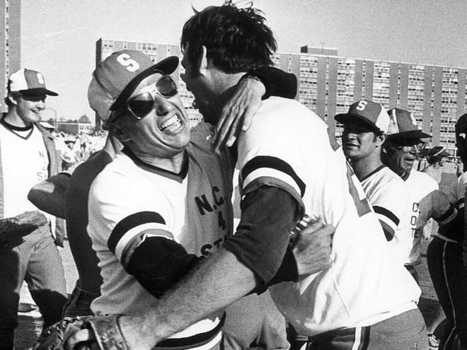 Esposito (left) hugs former star Tim Stoddard. Esposito coached NC State to four ACC titles and a College World Series appearance.