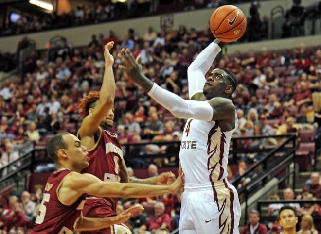 FSU sophomore Dwayne Bacon takes off for a thunderous dunk Monday against Boston College.