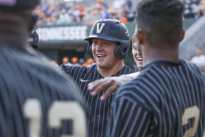 Stephen Scott celebrates one of his two homers in Vandy's 7-6 win over Tennessee on Friday.