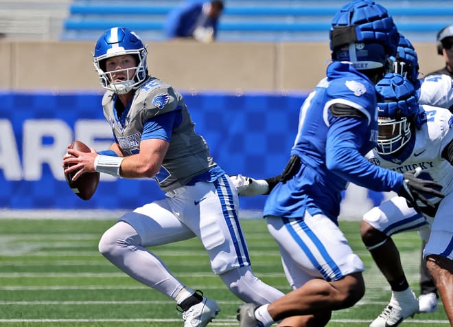 Kentucky quarterback Brock Vandagriff used his legs to escape pressure and complete a pass in Saturday's Blue-White Spring Game.