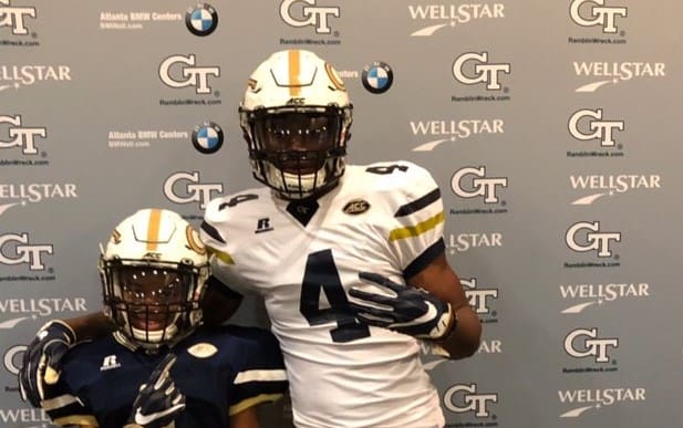Jahfari Harvey on the right poses with his little brother during his GT visit
