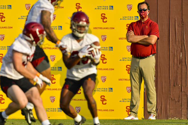 USC athletic director Mike Bohn watches the Trojans' first practice Friday.