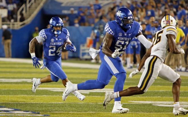 Kentucky running back Chris Rodriguez followed the block of Dare Rosenthal for some of his 207 yards rushing in Saturday's win over Missouri.