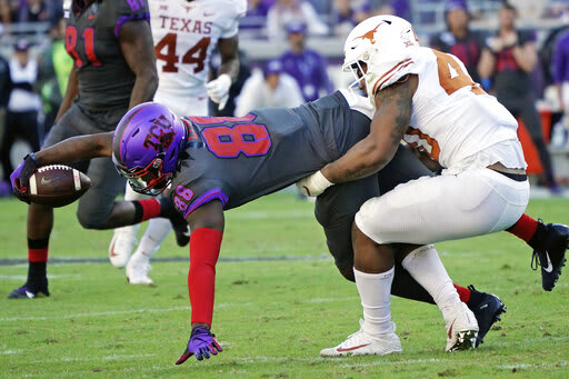 Artayvious Lynn stretches for more yardage when the Frogs beat Texas last season.