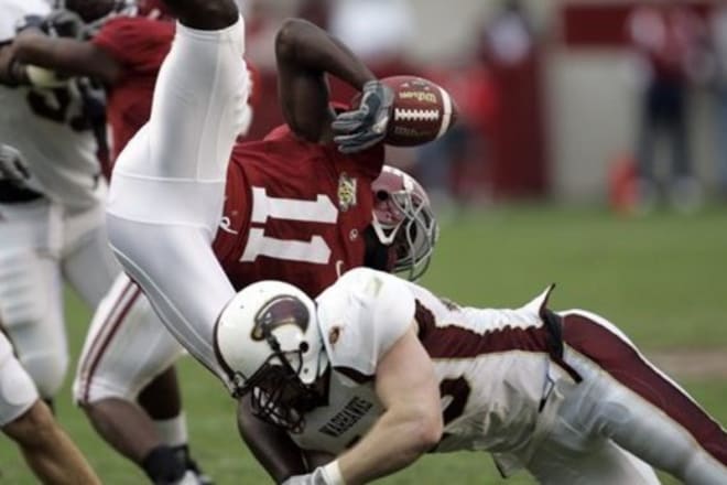 Alabama wide receiver Matt Caddell (11) loses the ball as he's tackled by a Louisiana-Monroe defender. Photo | Butch Dill The Associated Press