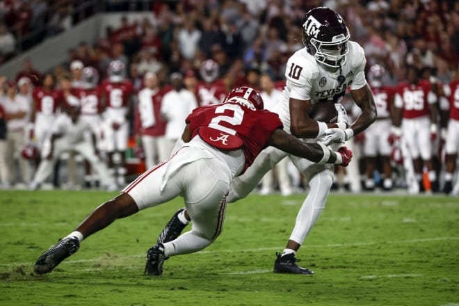 Texas A&M Aggies wide receiver Chris Marshall (10) catches a pass against Alabama Crimson Tide defensive back DeMarcco Hellams (2) at Bryant-Denny Stadium. Photo | Butch Dill-USA TODAY Sports