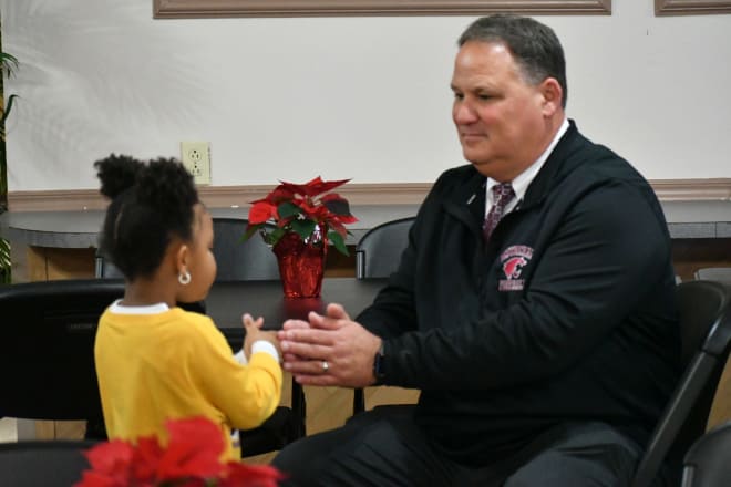 K'Amari Trudeaux entertains Destrehan football coach Stephen Robicheaux during National Signing Day on Dec. 19, 2019.