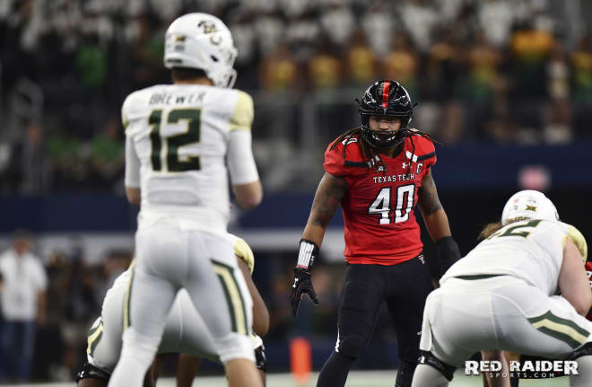 LB Dakota Allen stares down Baylor QB Charlie Brewer during the Texas Tech-Baylor game on Nov. 24, 2018 inside AT&T Stadium in Arlington. Photo by Steven Leija / Sideline Pros.