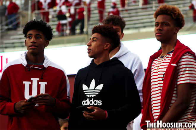 IU commit Armaan Franklin (left), freshman guard Rob Phinisee (middle) and freshman guard Romeo Langford (right) showed their support for IU's football team on Saturday.