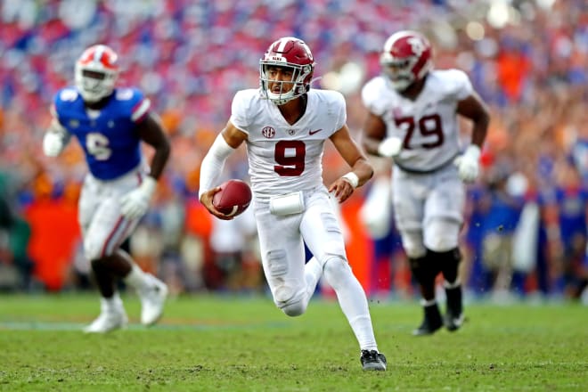 Alabama Crimson Tide quarterback Bryce Young (9) runs the ball during the fourth quarter against the Florida Gators at Ben Hill Griffin Stadium. Photo | USA Today