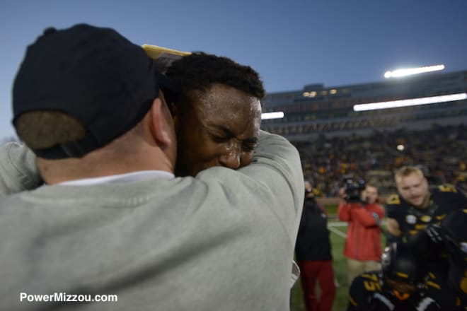 Harris embraces Missouri coach Barry Odom after his final college game last Friday against Arkansas