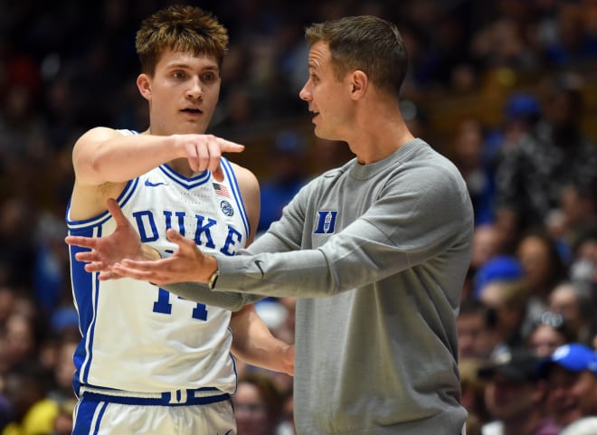 Duke's Jon Scheyer, right, talks to Jaden Schutt during a game in his freshman season. 