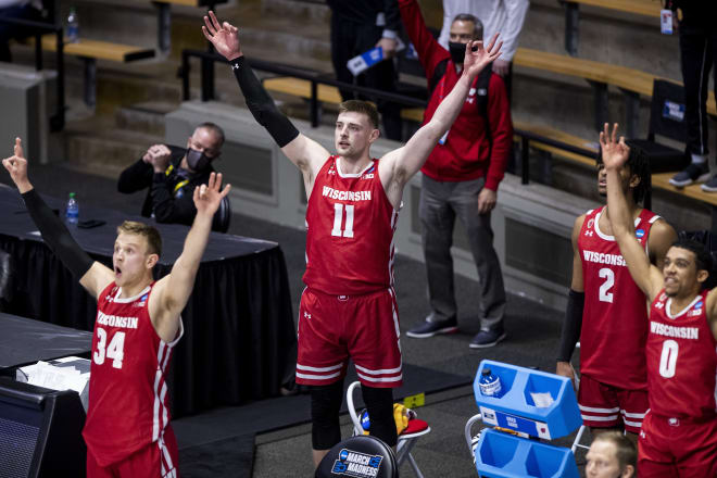 Wisconsin's Brad Davison (34), Micah Potter (11), Aleem Ford (2) and D'Mitrik Trice (0) celebrate a late three-point basket