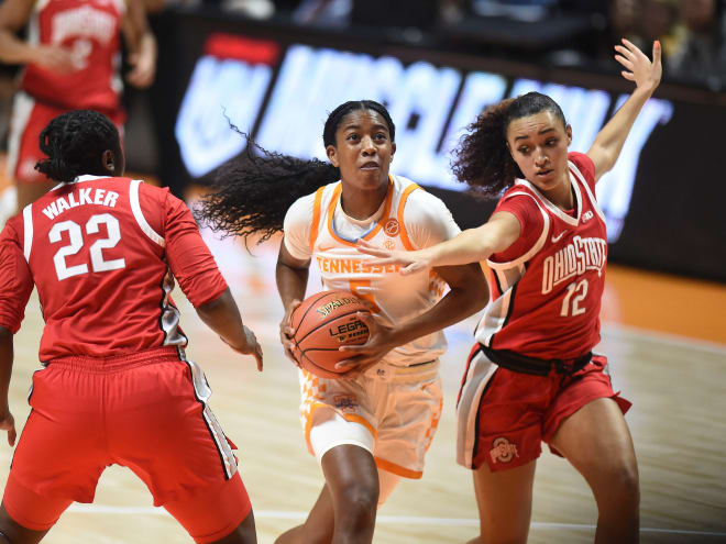 Tennessee's Kaiya Wynn (5) drives towards the basket while guarded by Ohio State's Celeste Taylor (12) and Eboni Walker (22) in an NCAA college basketball game on Sunday, December 3, 2023 in Knoxville, Tenn.