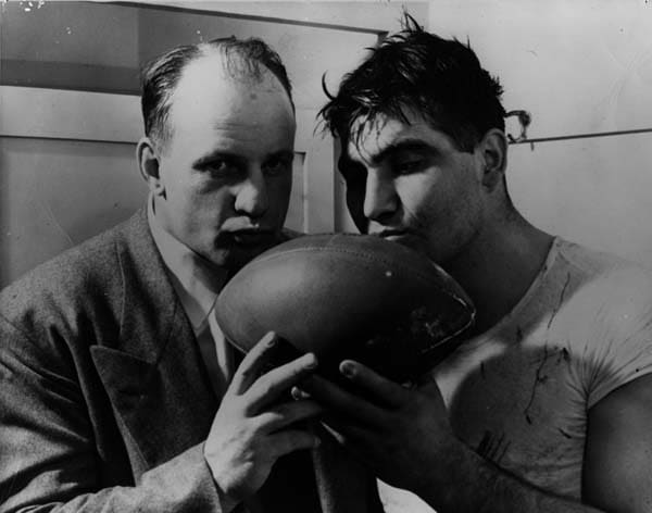 Coach Bob Voigts and All-American Alex Sarkisian celebrate NU's Rose Bowl win.