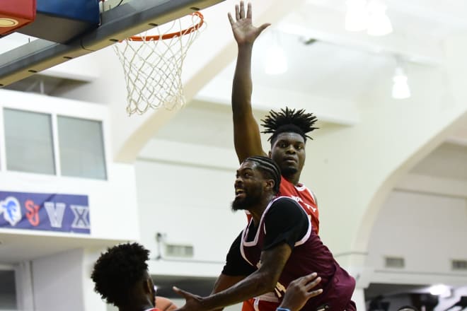 Noel Brown, making life difficult for Naji Marshall at the rim. 