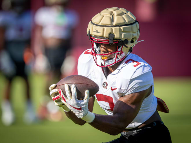 Trey Benson hauls in a pass in FSU's practice on Sunday. Benson's speed, vision and patience have made him a back who is tough to wrap up. (photo by Ross Obley)