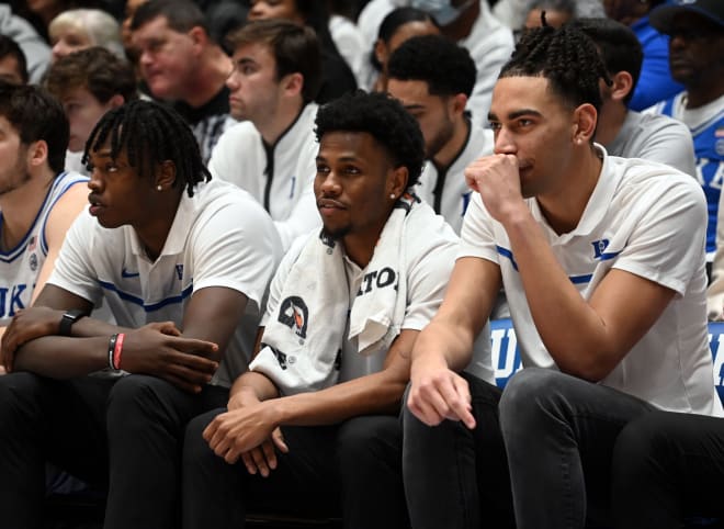 Duke's Mark Mitchell, left, Jeremy Roach, middle, and Christian Reeves watch Saturday's game against Pitt. 