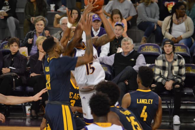 Kentrell Barkley battles in the lane for two of his 19 points in ECU's 87-81 loss to North Carolina A&T Sunday night.