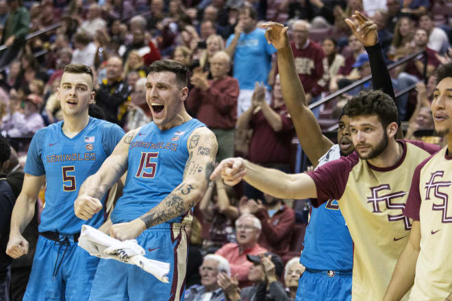 The Florida State bench celebrates a bucket on Tuesday night during the Seminoles' 82-67 win over Pitt. 