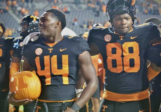 Tennessee linebacker Elijah Herring (44) celebrates with teammates following the Vols' 44-6 win over No. 19 Kentucky on Saturday. 