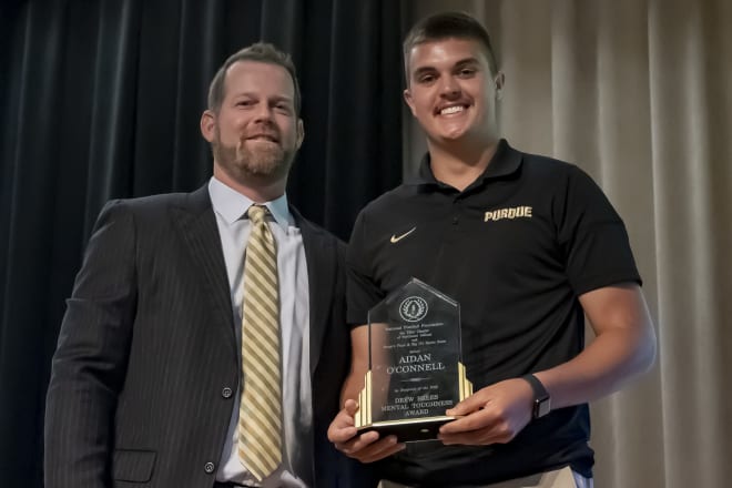 Aidan O'Connell received the Drew Brees Courage Award at today's National Football Foutndation--Joe Tiller Chapter banquet on Sunday at the Union Club Hotel. His position coach Brian Brohm was there to share it with the sixth-year senior quarterback.