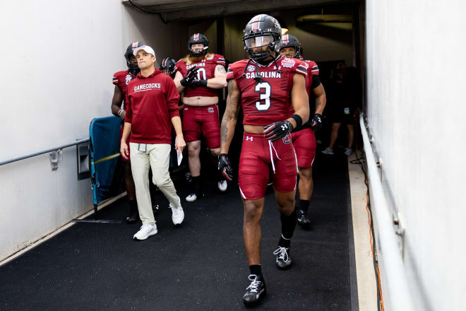 South Carolina Gamecocks head coach Shane Beamer and South Carolina Gamecocks wide receiver Antwane Wells Jr. (3) walk out the team tunnel before the game against the Notre Dame Fighting Irish in the 2022 Gator Bowl at TIAA Bank Field. Photo |  Matt Pendleton-USA TODAY Sports