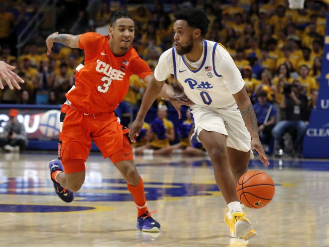Feb 25, 2023; Pittsburgh, Pennsylvania, USA; Pittsburgh Panthers guard Nelly Cummings (0) dribbles the ball against Syracuse Orange guard Judah Mintz (3) during the second half at the Petersen Events Center. Pittsburgh won 99-82. Mandatory Credit: Charles LeClaire-USA TODAY Sports