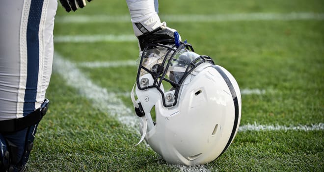 A Penn State Nittany Lions helmet rests on the grass during a 2020 practice. Photo courtesy of Penn State Athletics