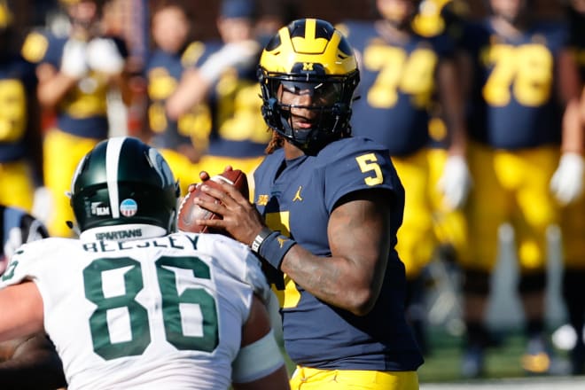 Michigan quarterback Joe Milton will play similarly to how Sean Clifford of Penn State did several weeks ago against the Hoosiers. Milton has just two total touchdowns through his first two games at quarterback for the Wolverines. (Rick Osentoski)