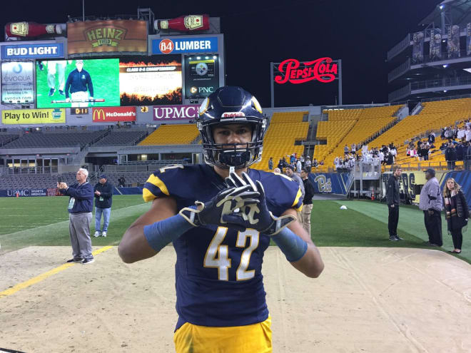 Thomas wears Pitt gloves in Heinz Field for the 6A WPIAL title game