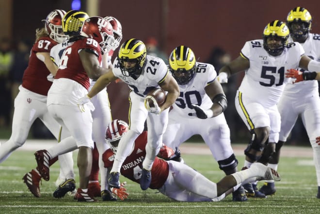 Michigan Wolverines football freshman running back Zach Charbonnet breaks a run against Indiana last week.