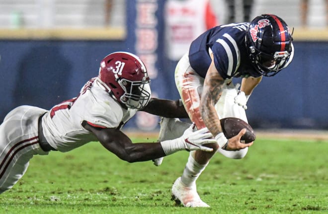 le Miss quarterback Matt Corral (2) is tackled by Alabama linebacker Will Anderson Jr. (31) at Vaught-Hemingway Stadium. Photo | USA Today