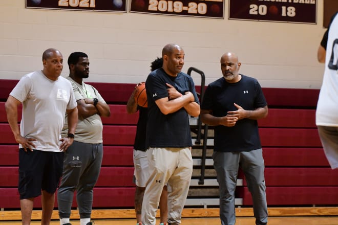 DCP's 16u unite, lead by HC Kenny Wills (right] qne Director Damon Handon (middle) approaches the game collaboratively. 