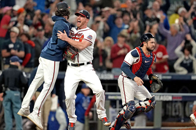 Atlanta Braves relief pitcher Will Smith (51) celebrates with catcher Travis d'Arnaud (16) after the Atlanta Braves beat the Los Angeles Dodgers in game six of the 2021 NLCS to advance to the World Series at Truist Park. Mandatory Credit: Dale Zanine-USA TODAY Sports