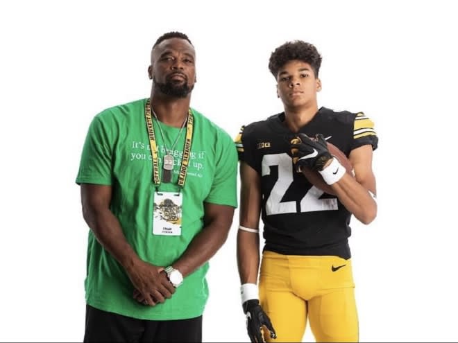 Braeden Jackson of Ankeny Centennial poses with his father on an Iowa visit. 