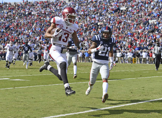 Arkansas wide receiver Deon Stewart scores on a 23-yard TD pass from Coley Kelley late in the second quarter of Arkansas'  38-37 win at Ole Miss Saturday. 
