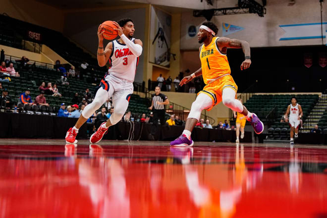 Ole Miss Rebels forward Myles Burns (3) drivers to the basket as Siena Saints guard Jared Billups (1) defends during the first half at ESPN Wide World of Sports. Mandatory Credit: Rich Storry-USA TODAY Sports