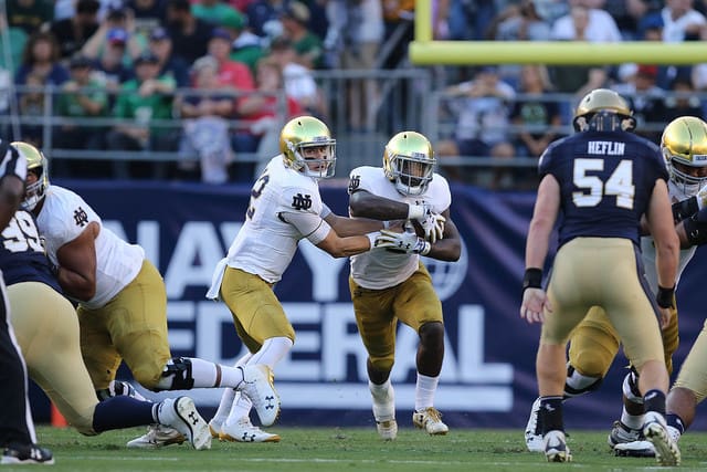 Ian Book completed 27 of 33 passes for 330 yards and two touchdowns for the Irish, while Dexter Williams carried 23 times for 142 yards and three scores.