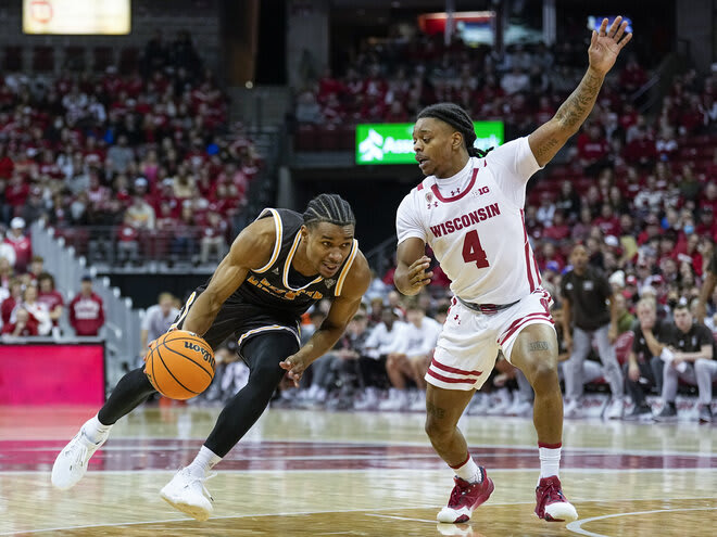 Western Michigan's Jefferson Monegro, left, drives against Wisconsin's Kamari McGee in the first half.