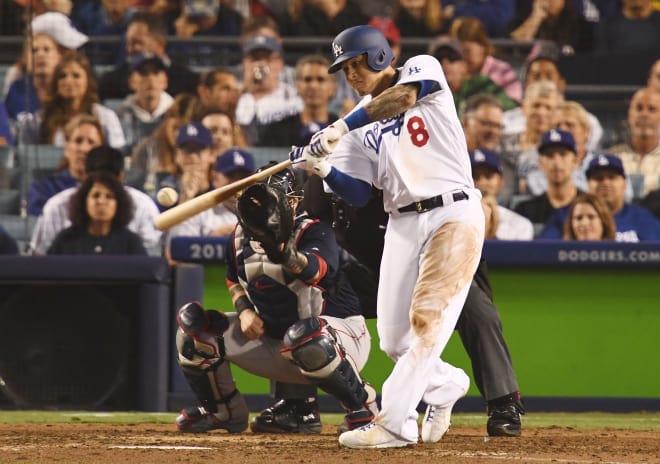 Free agent infielder Manny Machado, shown here playing for the Los Angeles Dodgers against the Boston Red Sox in the World Series in October, has meetings with the New York Yankees and Chicago White Sox scheduled in the coming days. 
