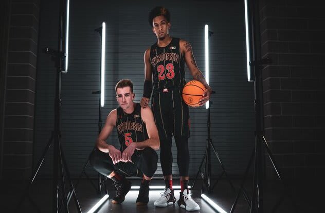 Senior Tyler Wahl (5) and Chucky Hepburn (23) style Wisconsin's new alternative uniforms.