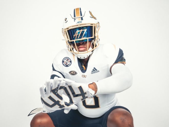 Wright poses in at Georgia Tech jersey during his visit on Thursday